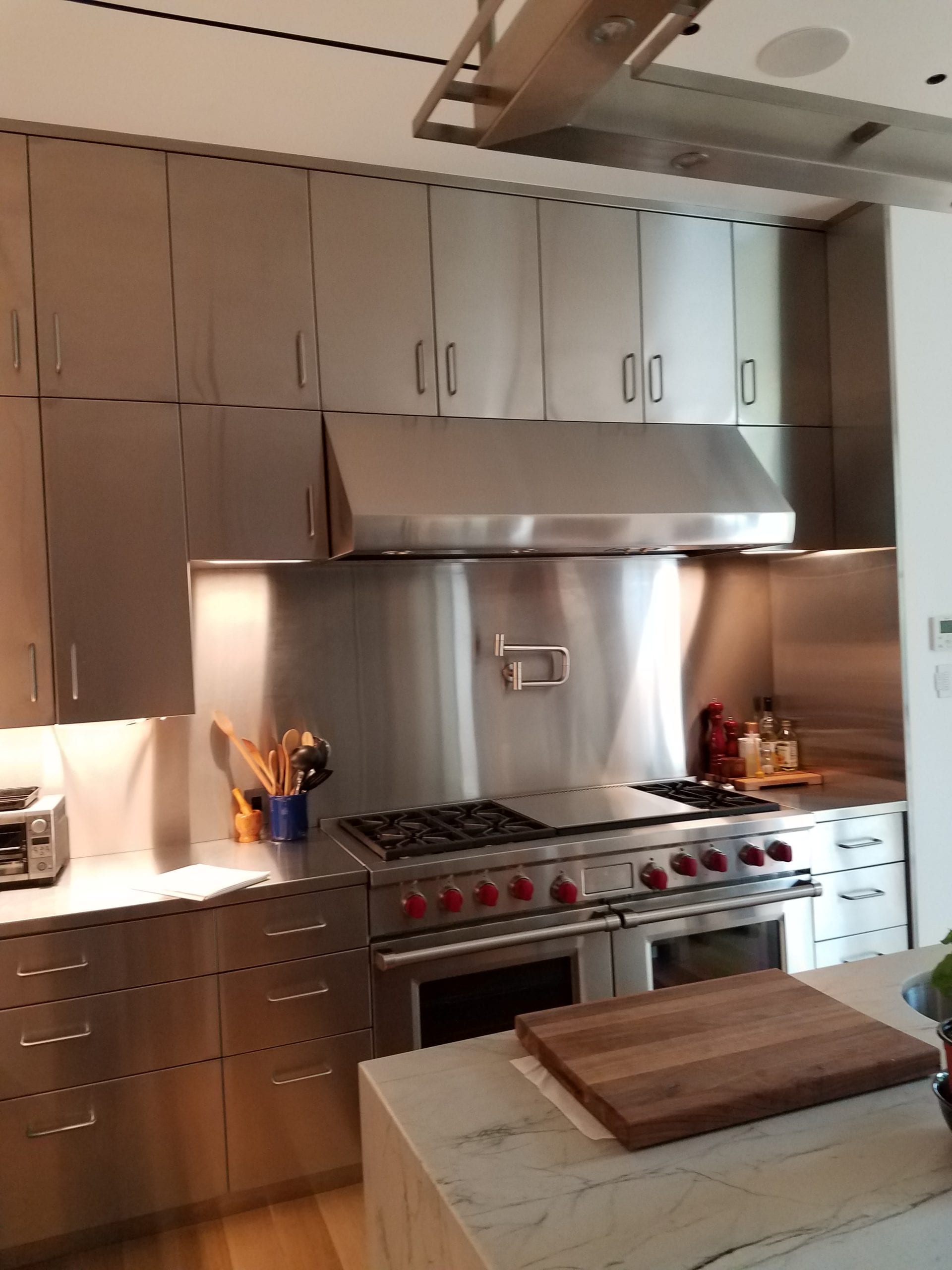 Custom stainless steel kitchen range and cabinetry