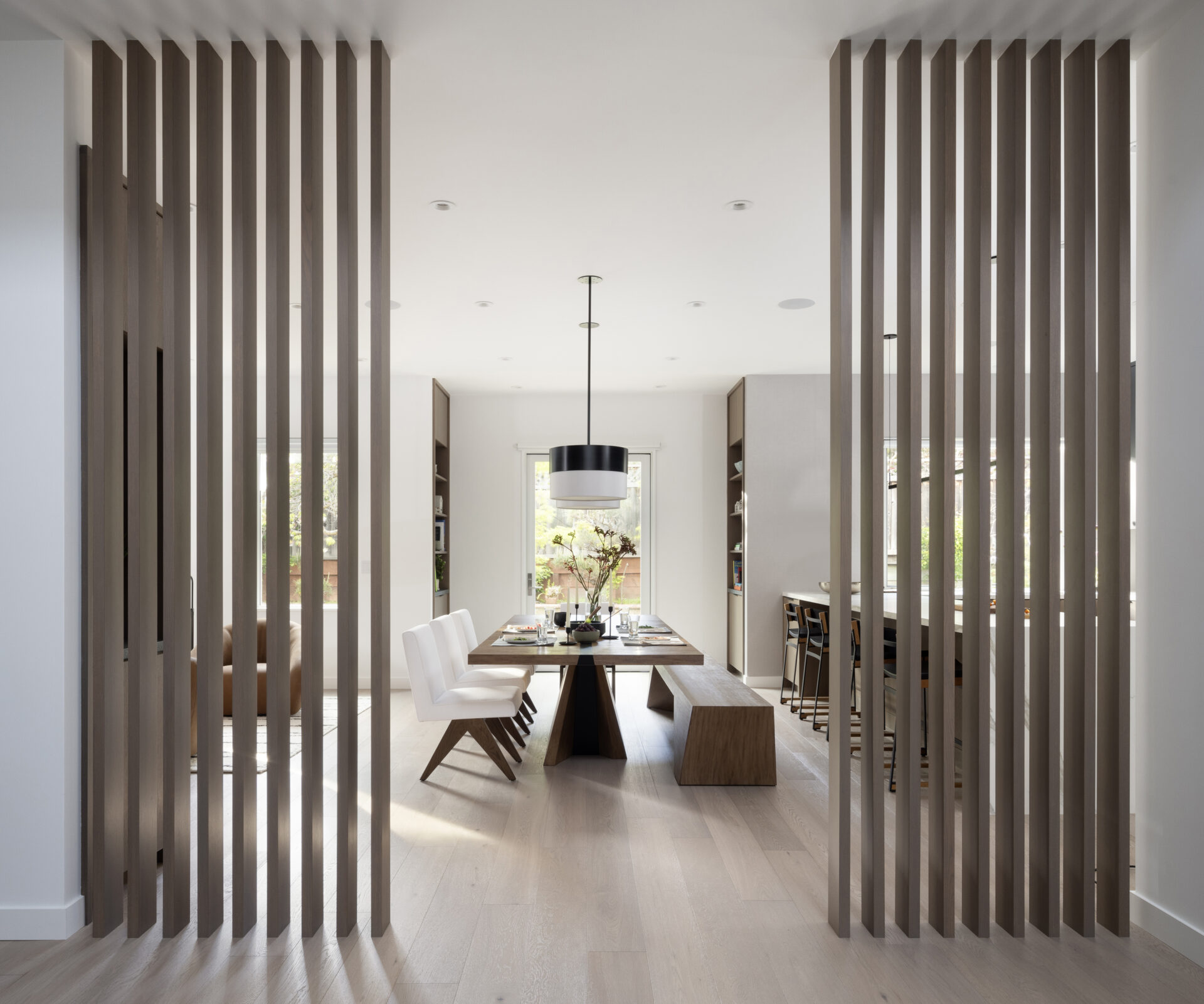 Custom dark wood slat dining room divider