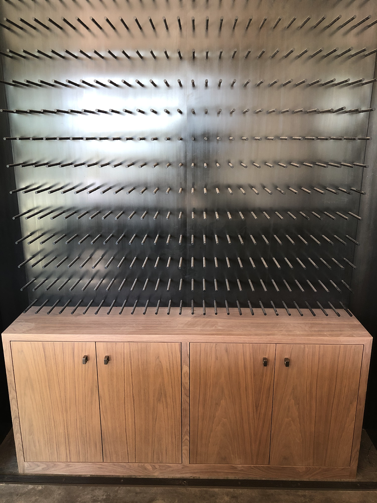 Walnut cabinet with custom wine peg display